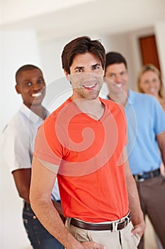Portrait, happy man and professional in office with people for working, business and agency career. Male worker
