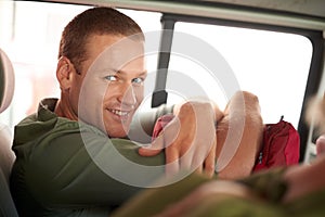 Portrait, happy and man on road trip in car for outdoor adventure, freedom and travel for summer vacation