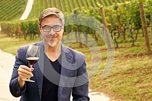 Portrait of happy man in vineyard