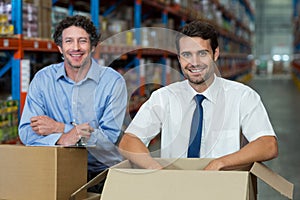 Portrait of happy managers are posing during work