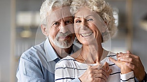 Portrait of happy mature couple hug showing love and care