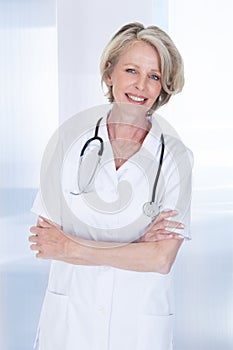 Portrait of happy mature female doctor