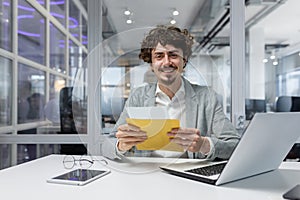 Portrait of happy mature investor businessman in office, man looking at camera and shocked happy and smiling, boss