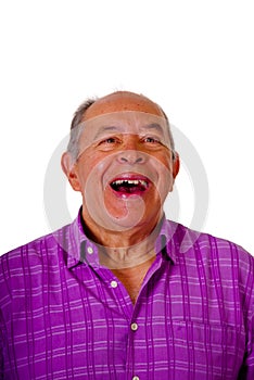 Portrait of a happy mature man laughting very loud and wearing a purple square t-shirt in a white background