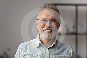 Portrait of happy mature old retired man in eyewear.