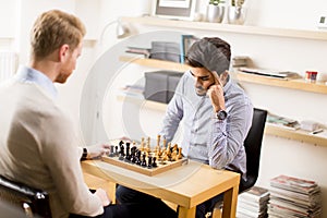 Portrait of a happy men playing chess