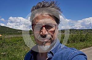 Portrait of happy mid adult man with confident smile outdoor