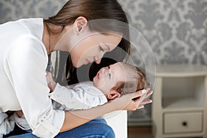 Portrait of happy mother and baby.