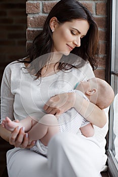 Portrait of happy mother and baby