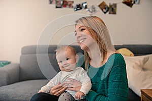 Portrait of happy mother with cute baby girl