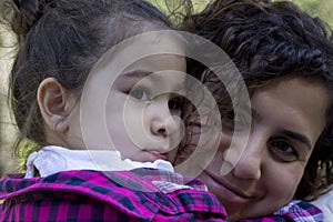 Portrait of happy mother and doughter in the park