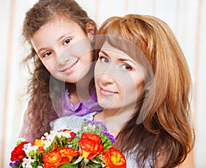 Portrait of happy mother and her little daughter