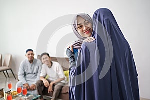 Mother hug her daughter during ramadan visit photo
