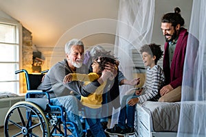 Portrait of happy multi-generation multiethnic family having fun together at home