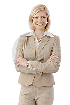 Portrait of happy office worker in beige suit