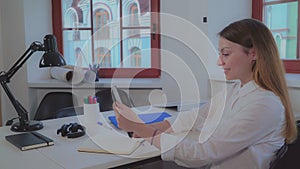 Portrait happy office worker has video call with partner