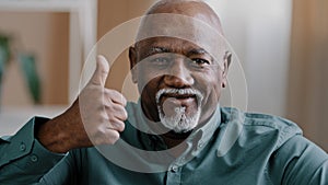 Portrait of happy old male ethnic elderly African American man senior showing thumb up positive grandfather looking at