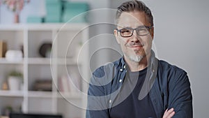 Portrait of happy older casual man at home smiling