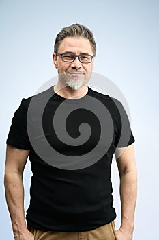 Portrait of happy older casual man on white smiling