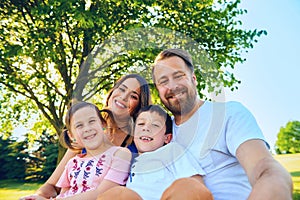 Portrait of happy parents with their children