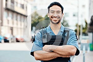 Portrait, happy or policeman in city with arms crossed for law enforcement, surveillance or street safety. Confident cop