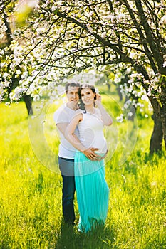 Portrait of happy pregnant family