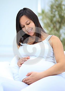Portrait of a happy pregnant woman.