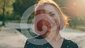 Portrait happy pretty caucasian red-haired beautiful attractive young girl student woman with short fluttering hair