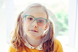 Portrait of happy pretty smiling teen girl in glasses