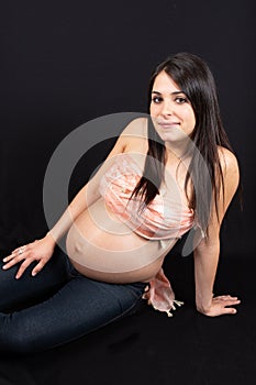 Portrait of happy pretty young pregnant woman