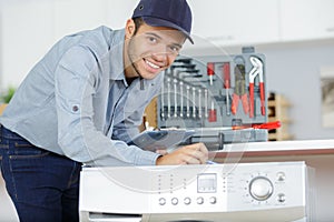 portrait happy repairman looking at camera