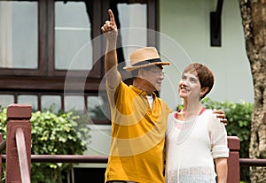 Portrait of happy romantic Asian senior couple outdoor in park