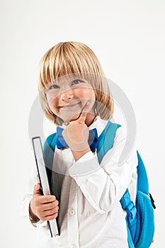 Portrait of happy schoolboy with books and apple isolated on white background. Education, isolated.