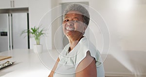 Portrait of happy senior african american woman at home