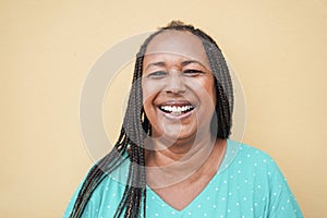 Portrait of happy senior african woman looking at camera - Focus on face