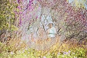 Portrait of happy senior beautiful woman in spring park