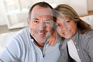 Portrait of happy senior couple at home