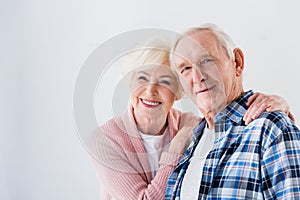portrait of happy senior couple looking