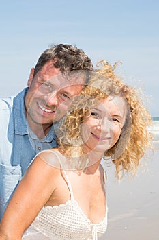 portrait of a happy senior couple mature love on beach coast vacation