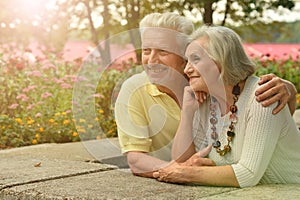 Portrait of happy senior couple posing outdoors