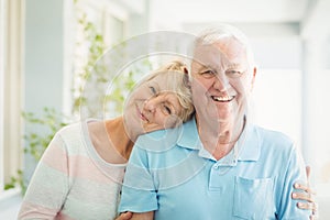 Portrait of happy senior couple smiling