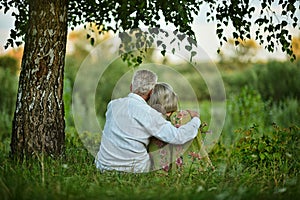 Portrait of happy senior couple taking rest outdoors
