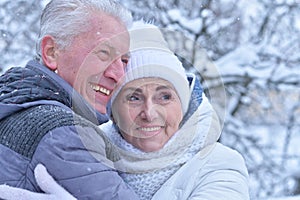 Portrait of happy senior couple at winter outdoors