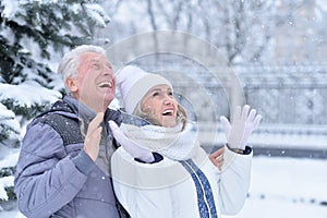 Portrait of happy senior couple at winter outdoors