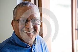 Portrait of happy senior man at nursing home