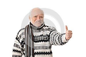 Portrait of happy senior man with thumb up