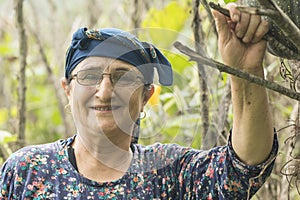 Portrait of a happy senior muslim woman with eyeglass at pumpkin