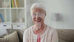 Portrait of happy senior woman face at home