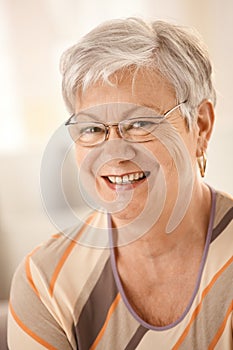 Portrait of happy senior woman with glasses