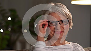 Portrait of happy senior woman at home in evening